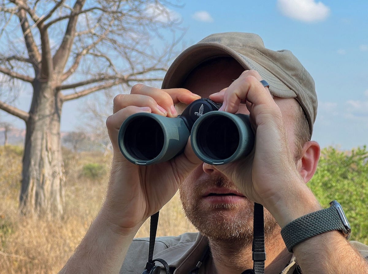Austin glassing the savanna with Swarovski binoculars