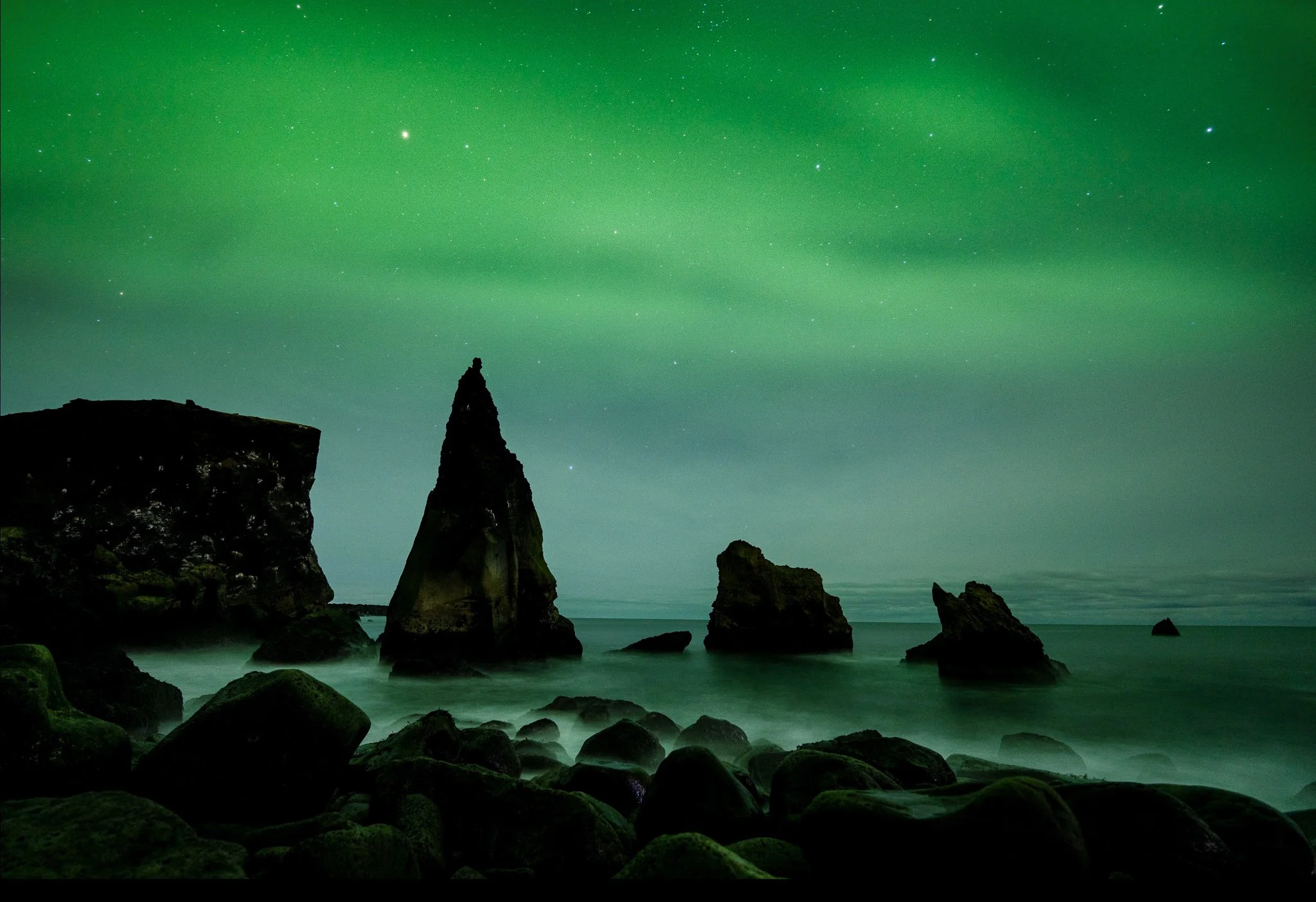 Aurora over the sea stacks