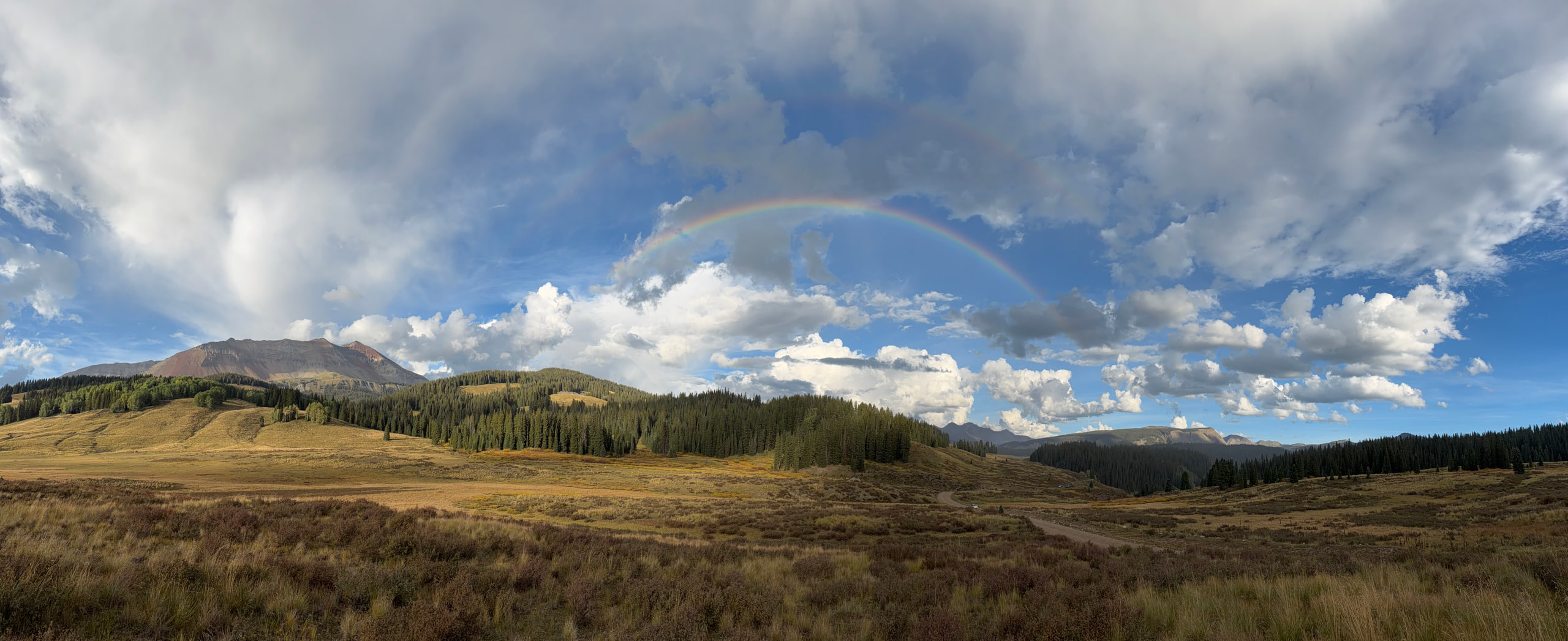 Double-rainbow at sunset over El Diente