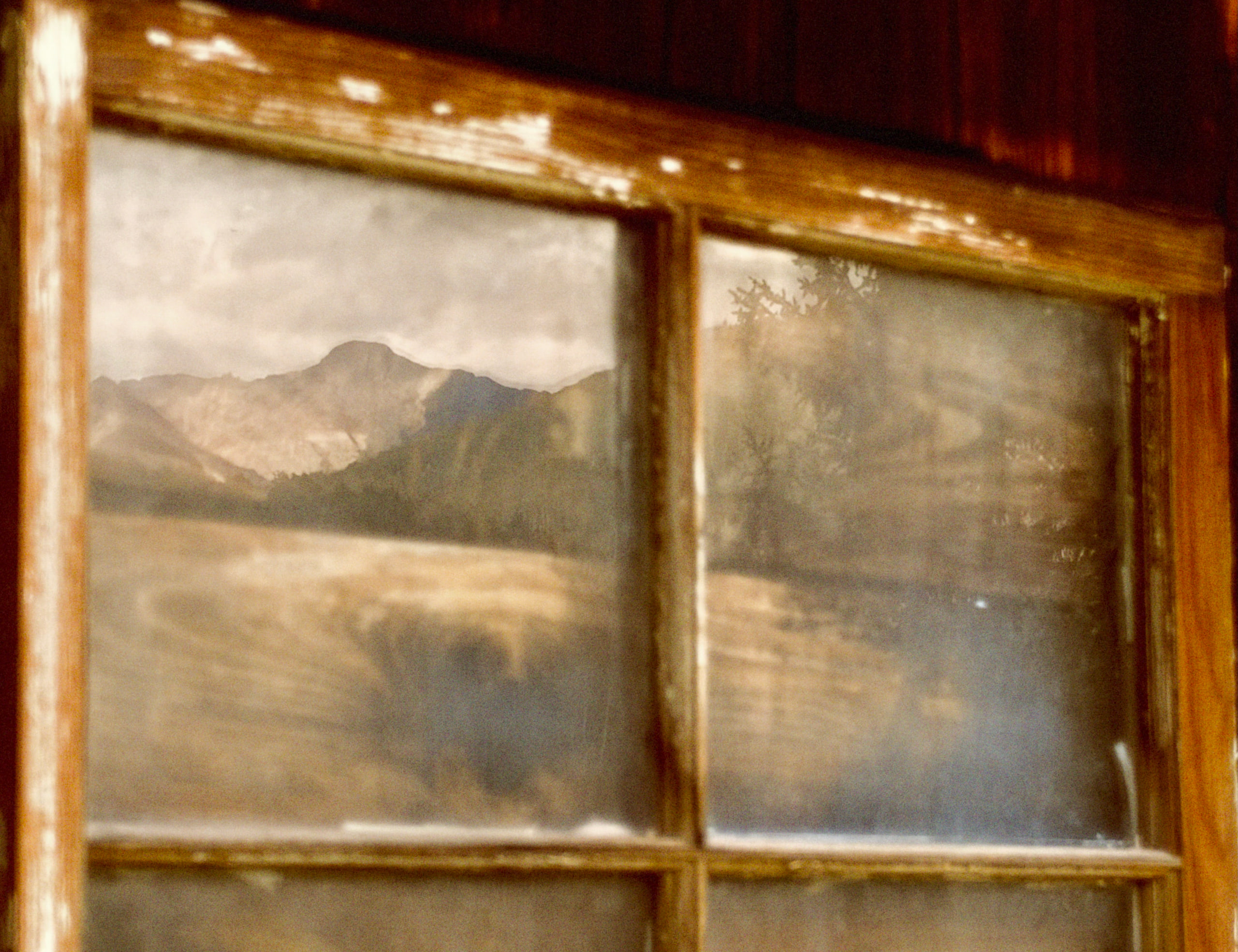 El Diente and the Wilson Range in the reflection of Dunton Store